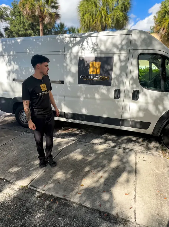 Ozzifloors installer next to our mobile showroom van